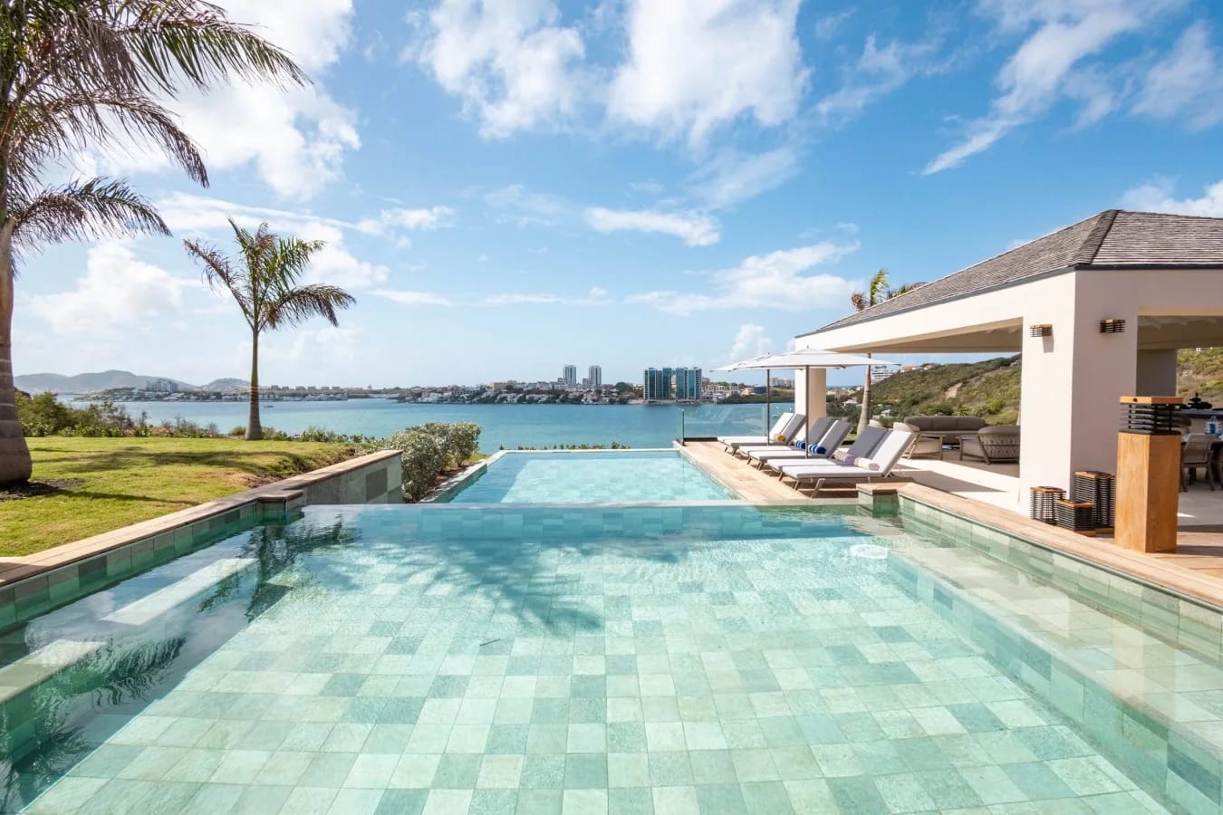 The infinity pool and pavilion facing the lagoon